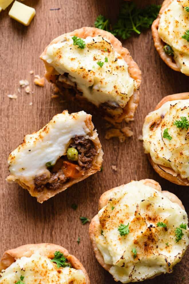 Cross section of cut mini shepherd's pie, showing ground meat, carrots and peas.