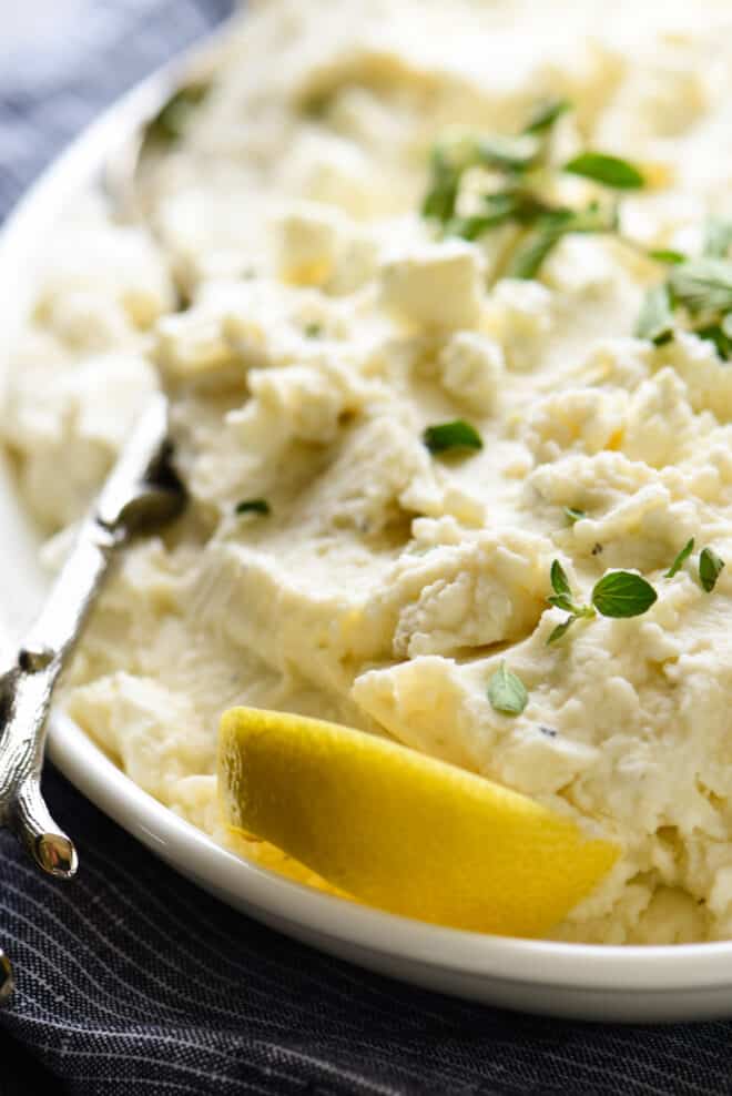 Closeup on Greek mashed potatoes topped with feta cheese.