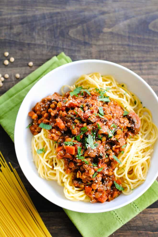 Large white bowl filled with spaghetti and vegan ragu.