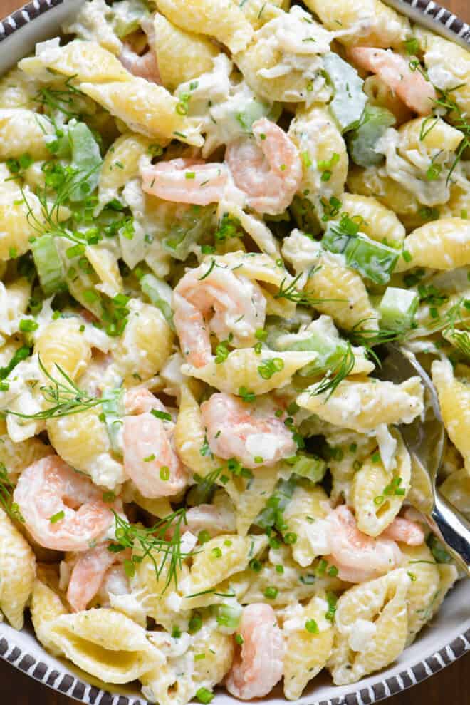 Creamy shell pasta noodles with shrimp, crab, celery and herbs.