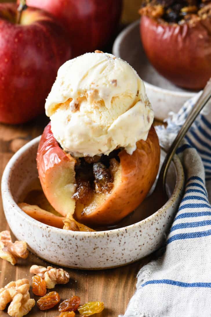 Baked apple filled with walnut filling and topped with ice cream.