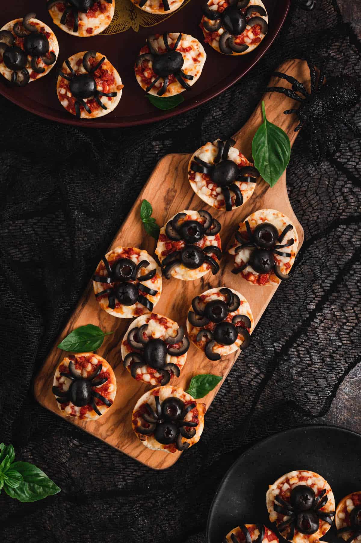 Halloween mini pizzas, made with mini pepperoni frozen bagels and black olives.