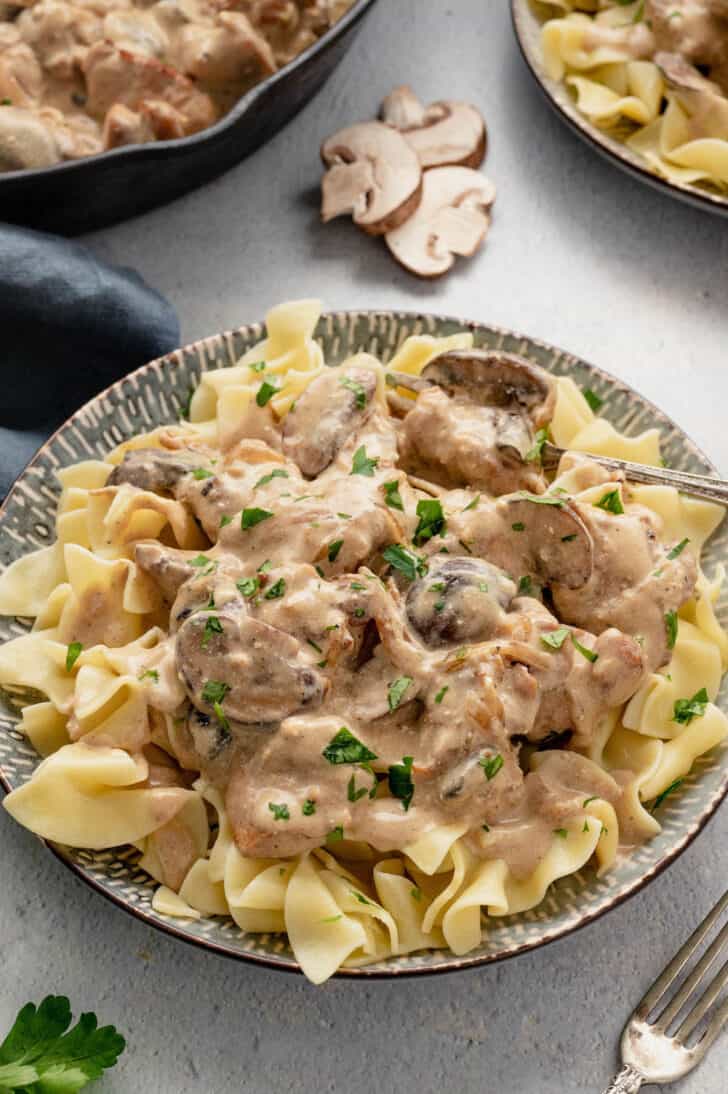 Creamy chicken stroganoff over egg noodles.