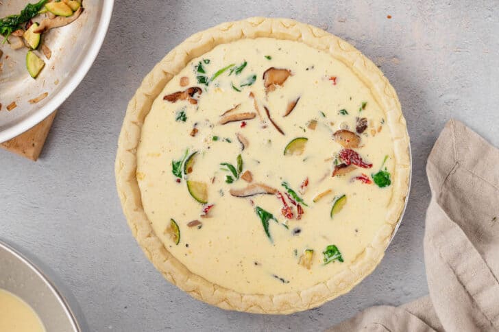 Sauteed mushrooms, shallots, zucchini and spinach in a pie shell, covered in an egg and milk mixture.