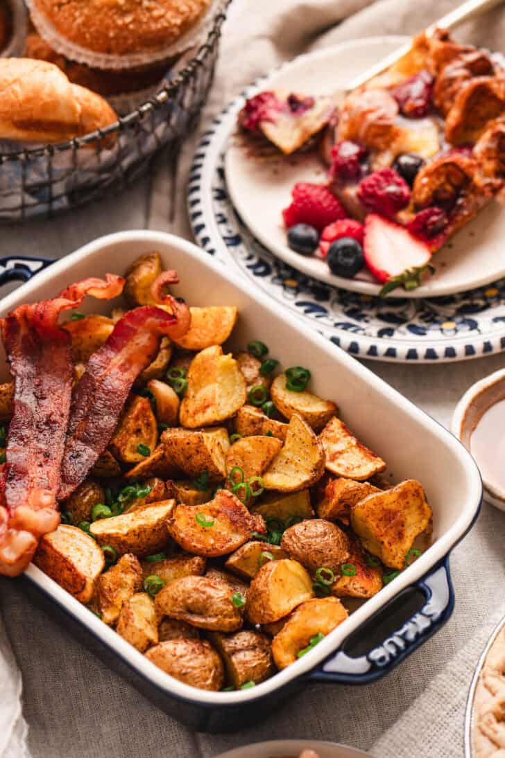 A pan of roasted potatoes and bacon.