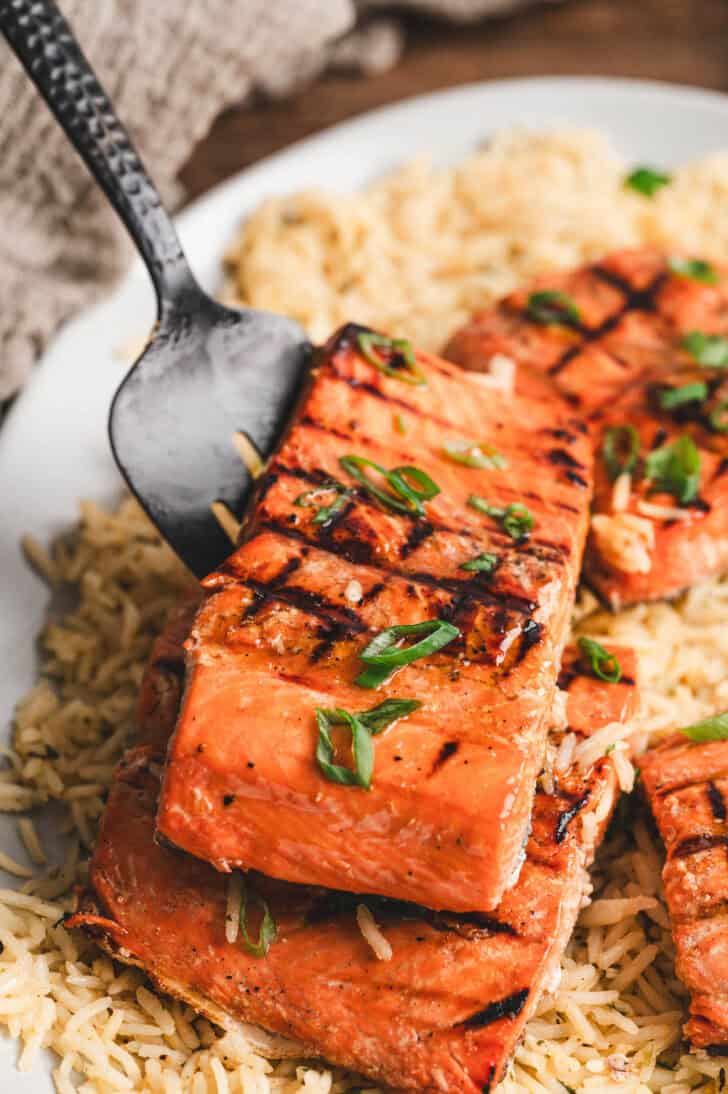 A piece of fish that has been soaked in salmon fish marinade and grilled.