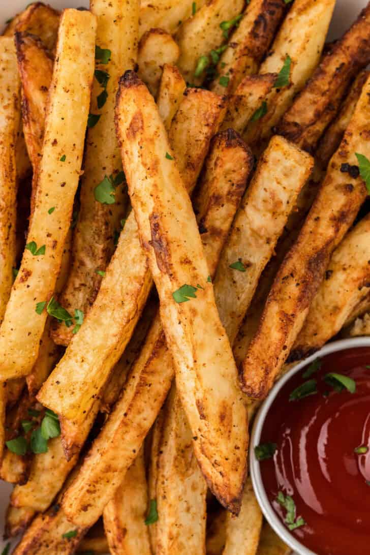 French fries in oven served with ketchup.