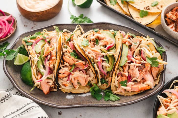 A platter filled with a simple salmon tacos recipe.