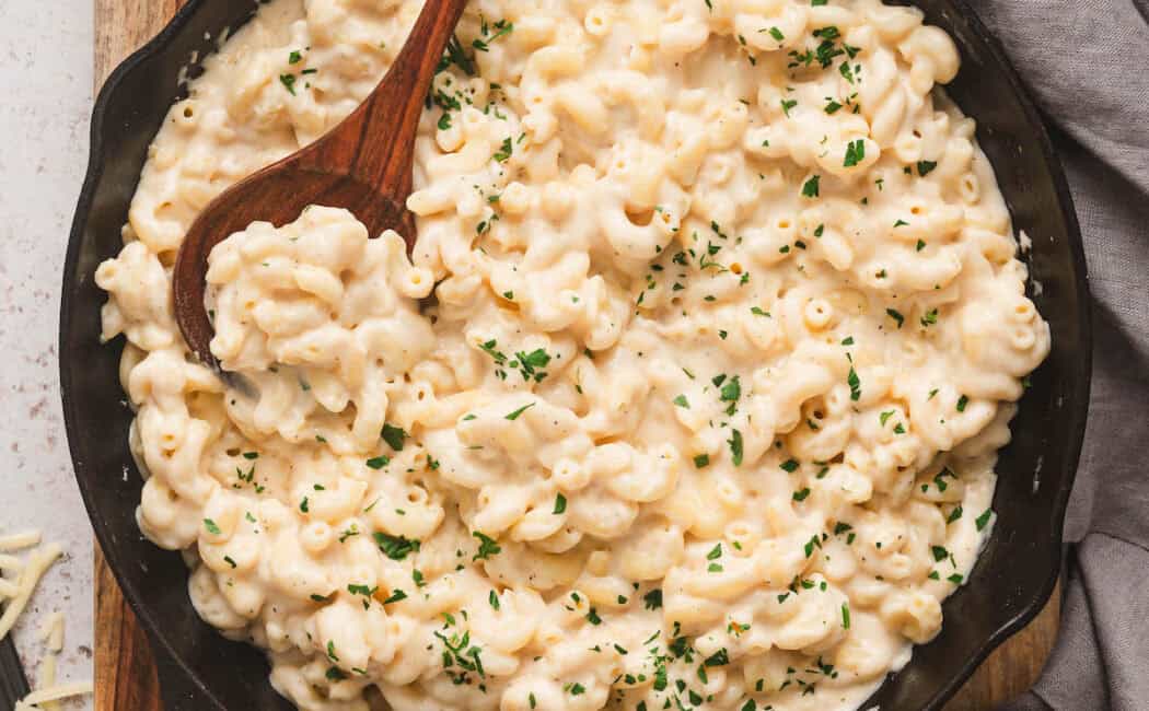 Stovetop mac and cheeses in a cast iron skillet.