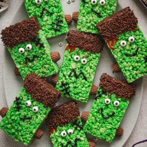 Frankenstein-shaped Halloween rice krispie treats on an oval platter.