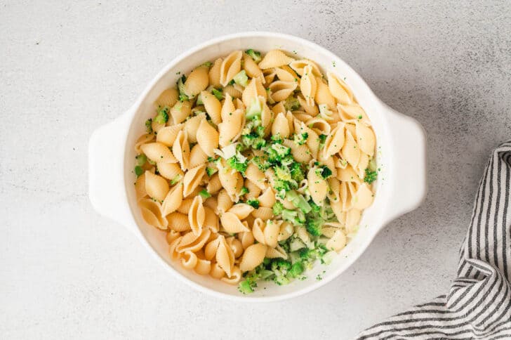 A white calendar filled with shells and broccoli.