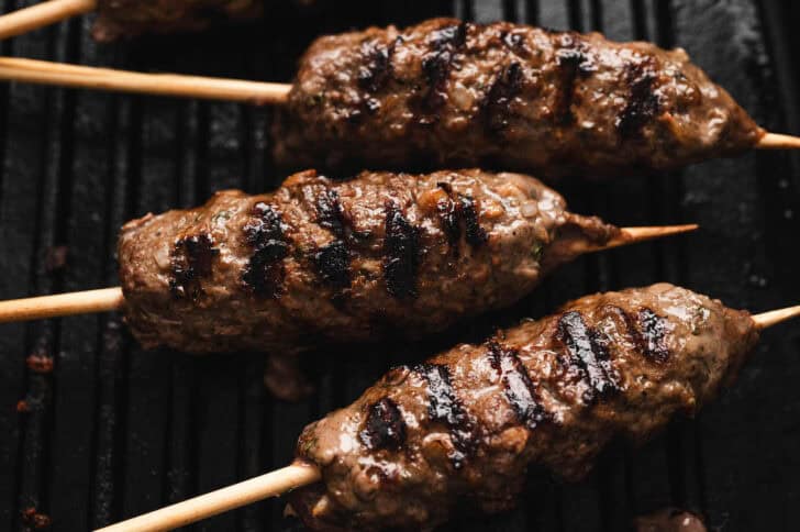 Meat skewers being grilled.