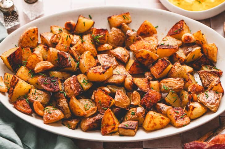 A white platter filled with a roasted breakfast potatoes recipe.