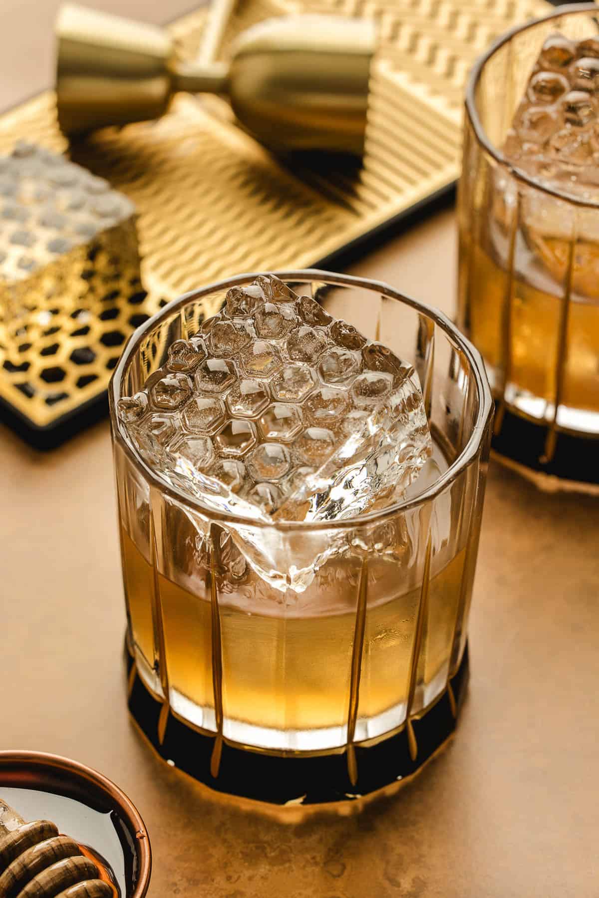 An old fashioned recipe with honey in rocks glasses.