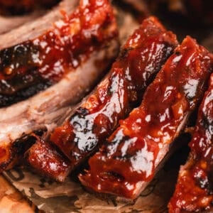 Sliced root beer ribs on brown paper.