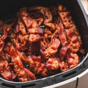 Bacon in air fryer basket.