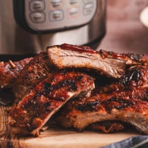 A pile of Instant Pot ribs on a cutting board.