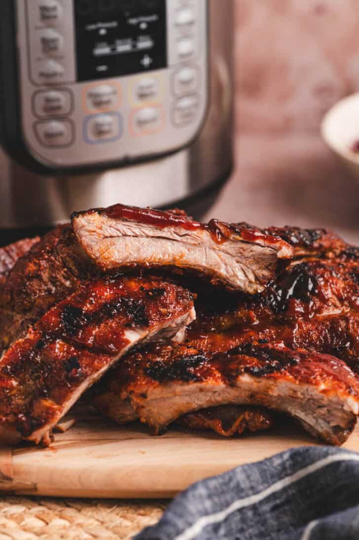 A pile of Instant Pot ribs on a cutting board.