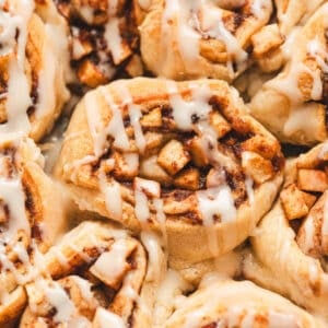 Crescent roll cinnamon rolls drizzled with frosting.