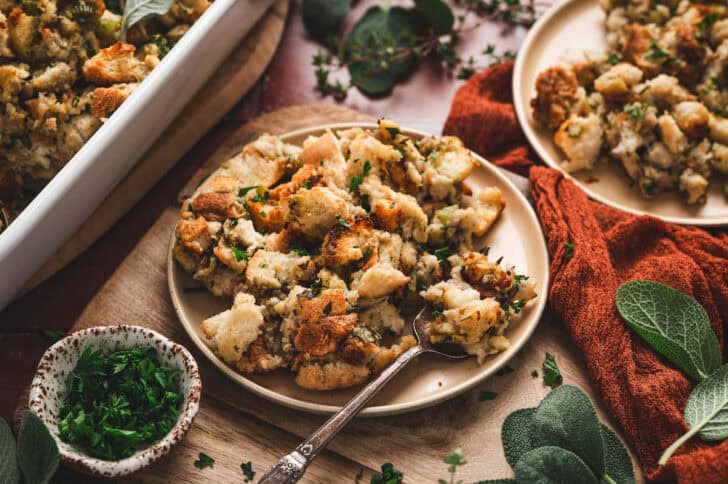 A plate of the best stuffing recipe with a fork scooping some up.