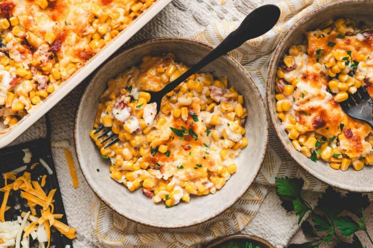 A bowl filled with cheese and corn casserole.