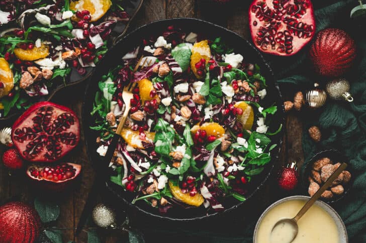 A holiday salad in a dark bowl.
