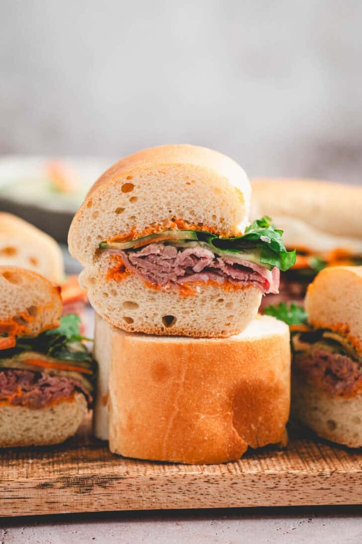 A stack of prime rib sandwiches made with jimmy john's day old bread.