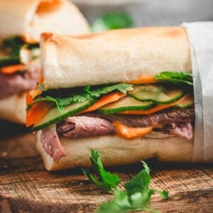 A side view of a prime rib sandwich recipe built on Jimmy John's day old bread.