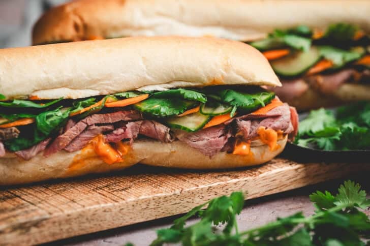 A side view of a prime rib leftover sandwich.