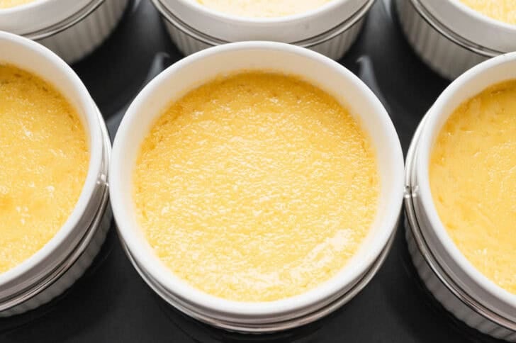 Closeup of a ramekin of creme brulee lemon after baking.