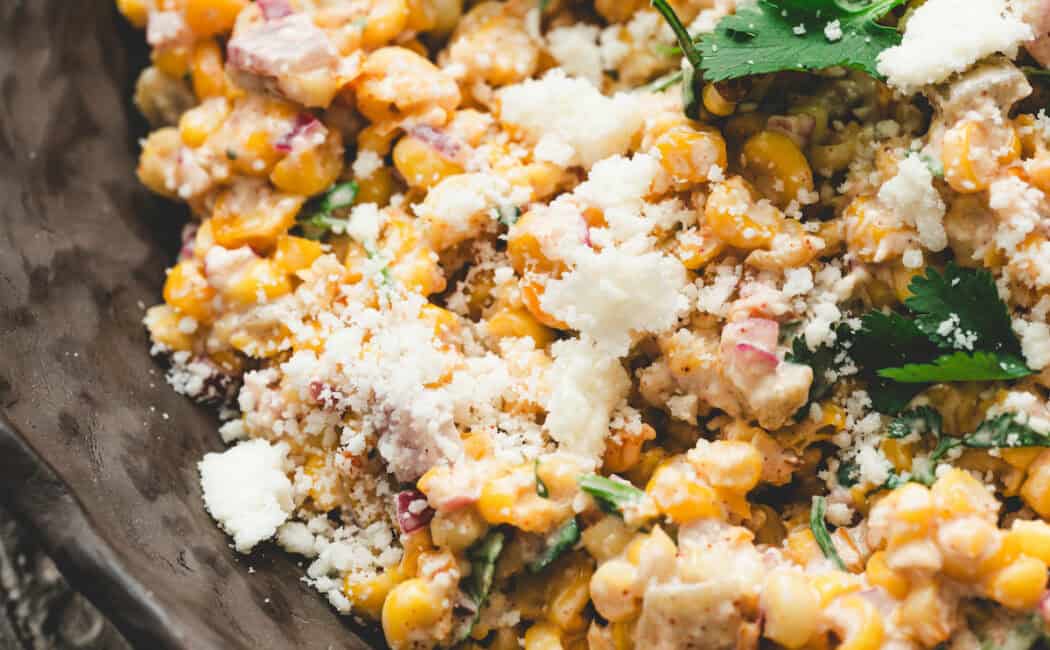 Closeup on a bowl of Mexican corn salad.