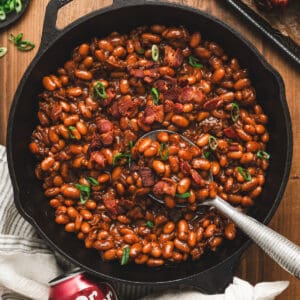 A skillet filled with Dr. Pepper baked beans.