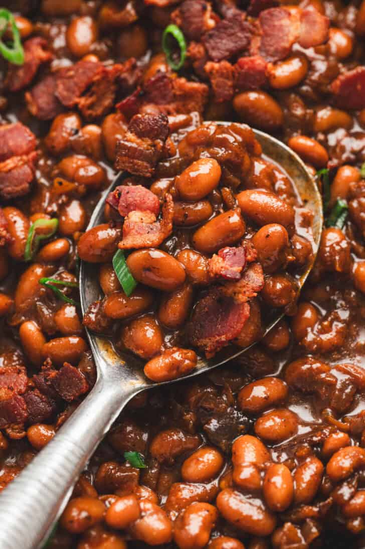 Closeup of a spoonful of Dr. Pepper baked beans.