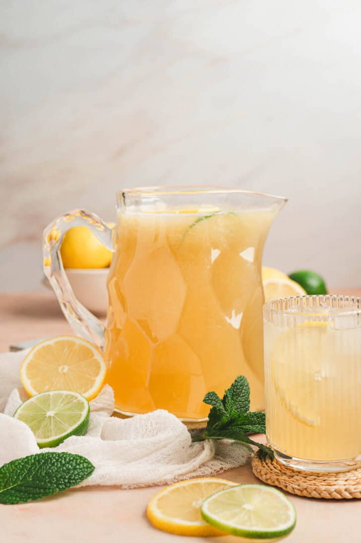 A glass pitcher filled with agave lemonade.