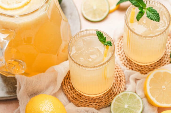 Glasses filled with Panera agave lemonade on bamboo coasters.