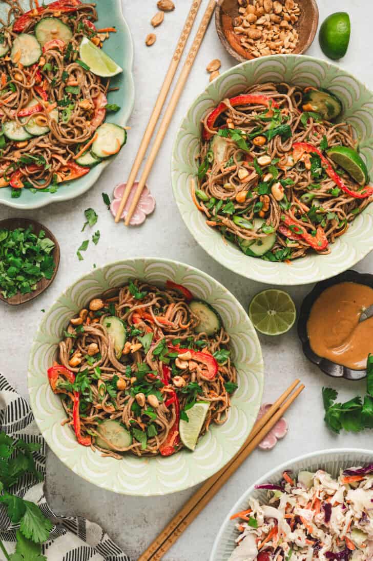 Two bowls filled with Asian noodle pasta salad.