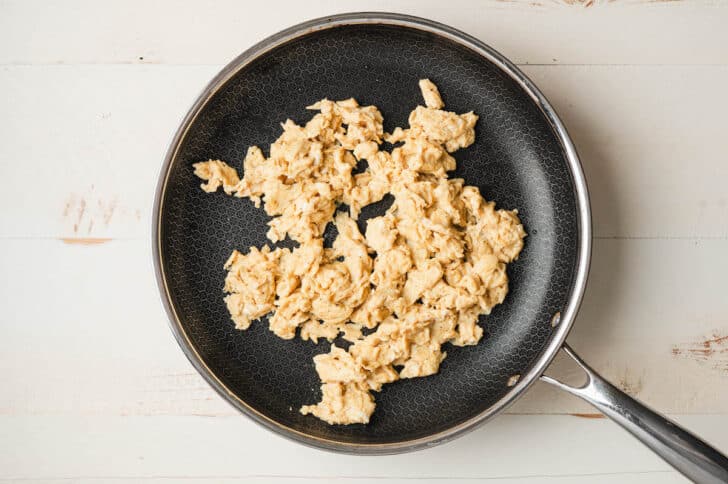 Scrambled eggs in a skillet.