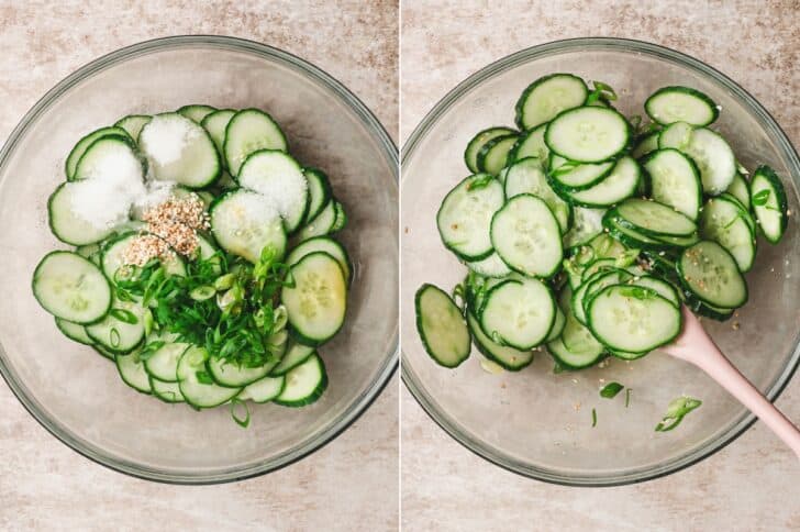 Two-panel process shot of sliced cucumbers topped with sugar, sesame seeds and scallions in a glass bowl, then tossed together with a pink spatula